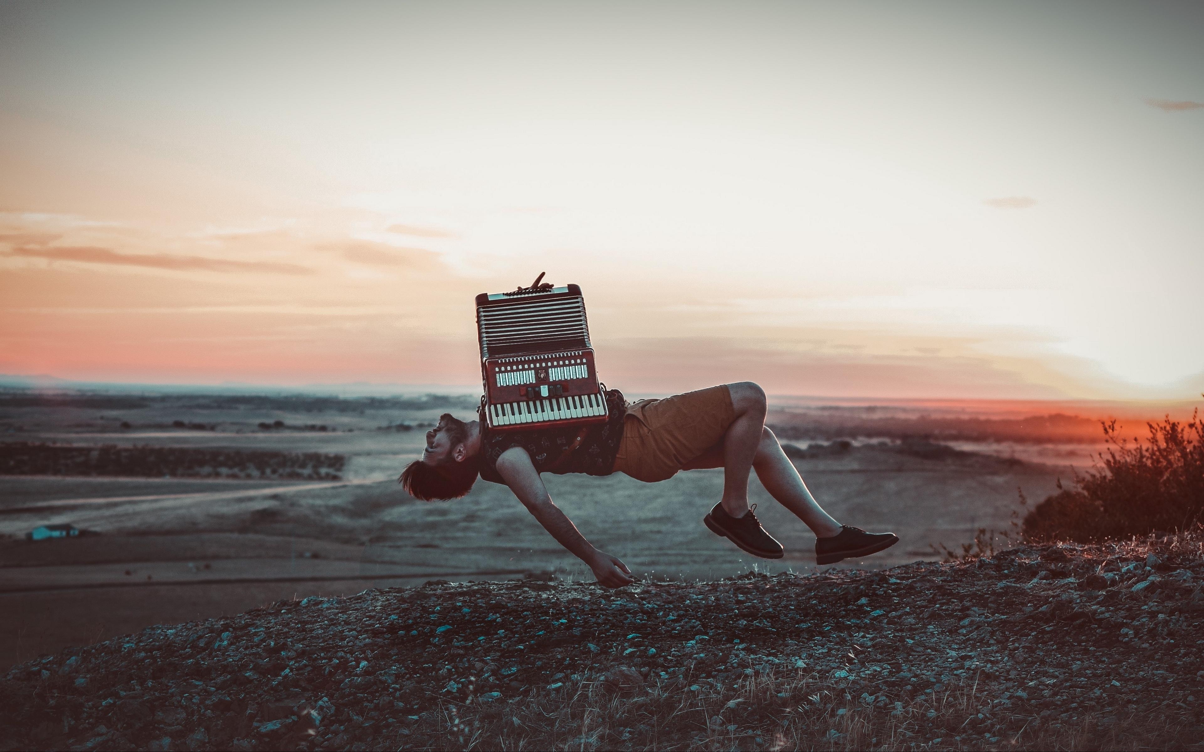 3840x2400 Download wallpaper  accordion, levitation, musician, flight, Desktop