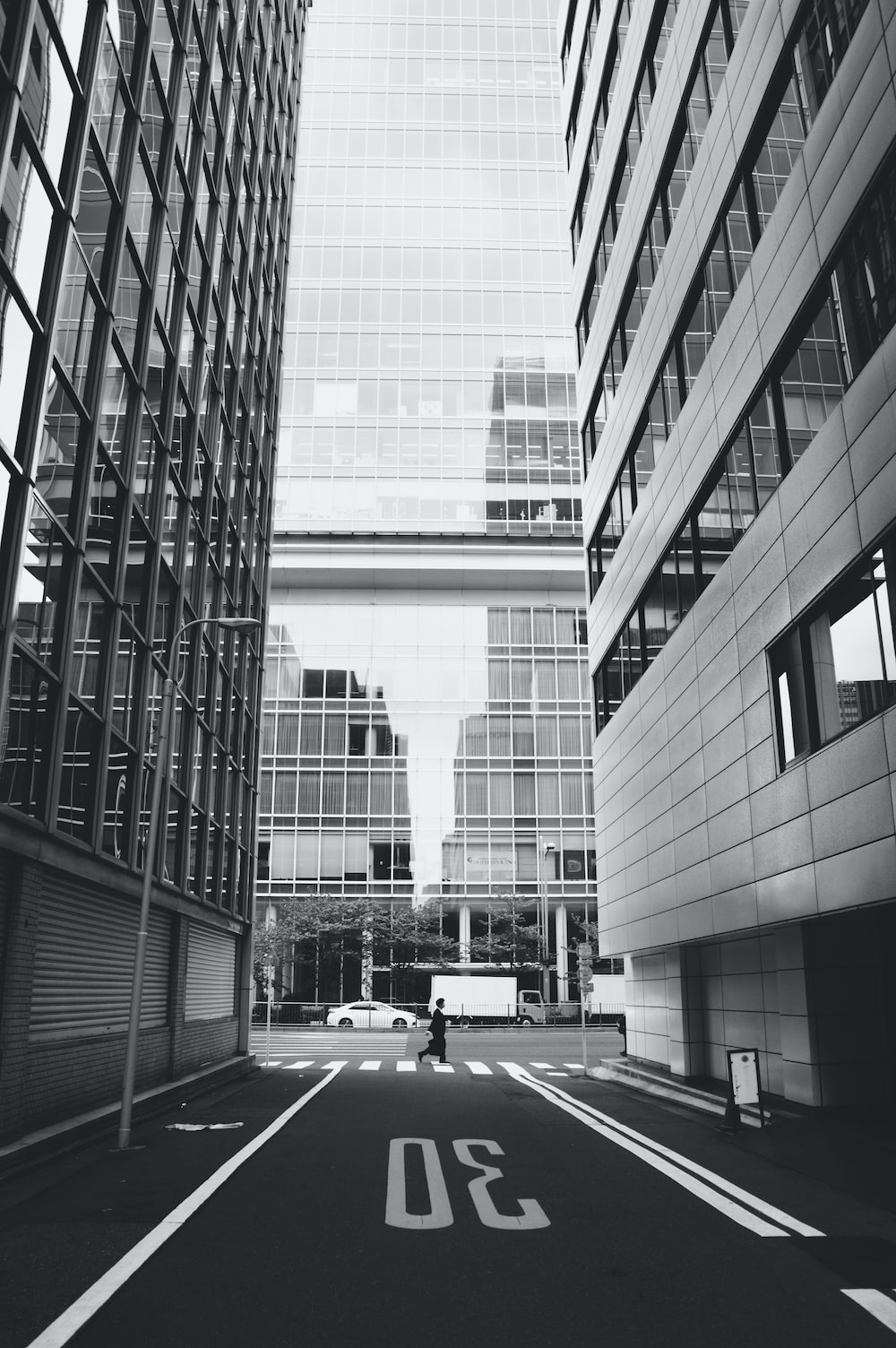 1000x1510 grayscale photo of cars on road near building photo, Phone