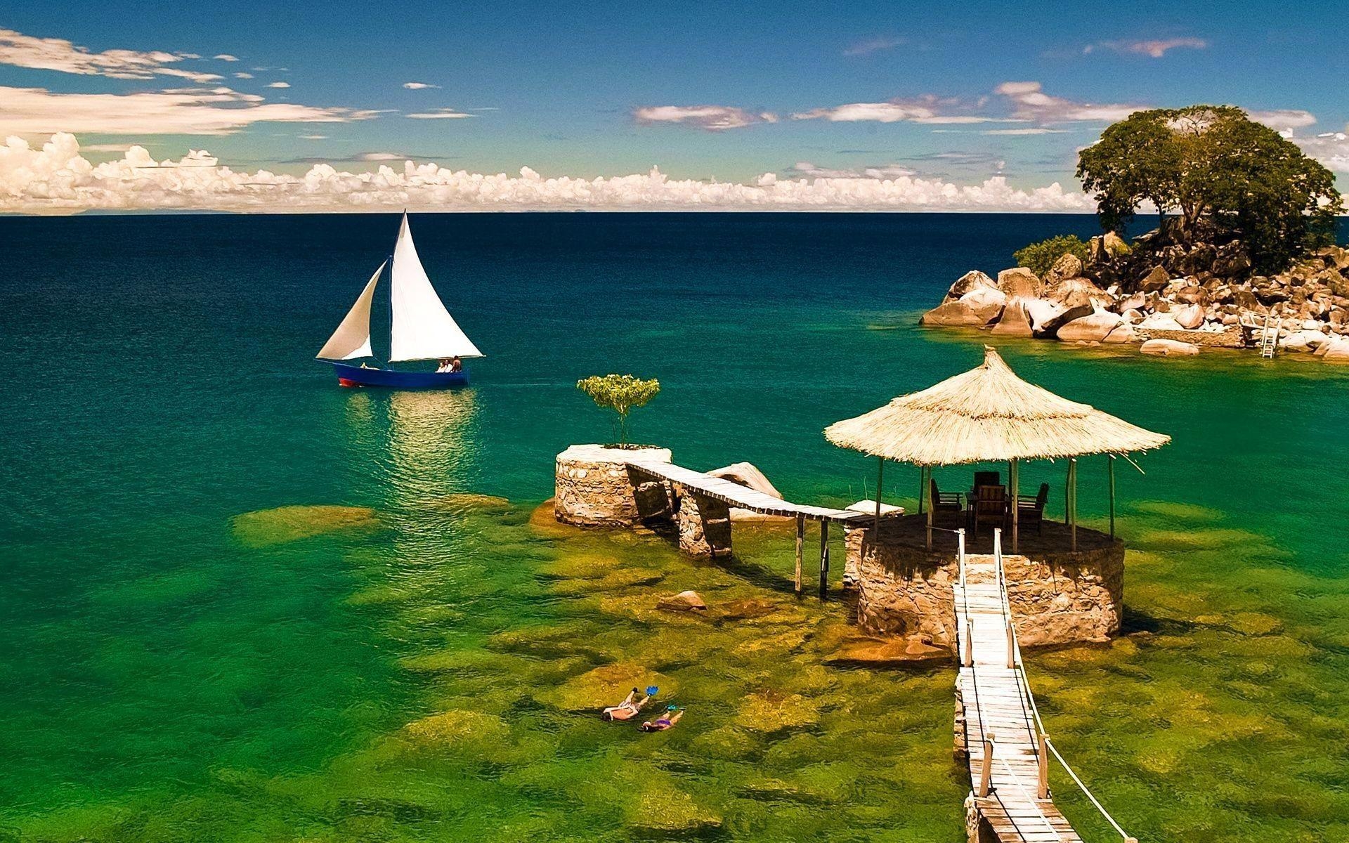 1920x1200 Lake Malawi Africa Stones Water Boat Umbrella Phone Wallpaper, Desktop