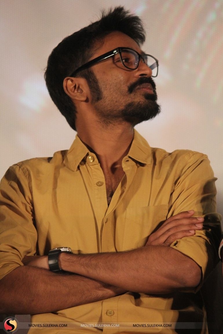 770x1160 of Dhanush Spotted at Anegan Film Audio Launch, Dhanush, Phone