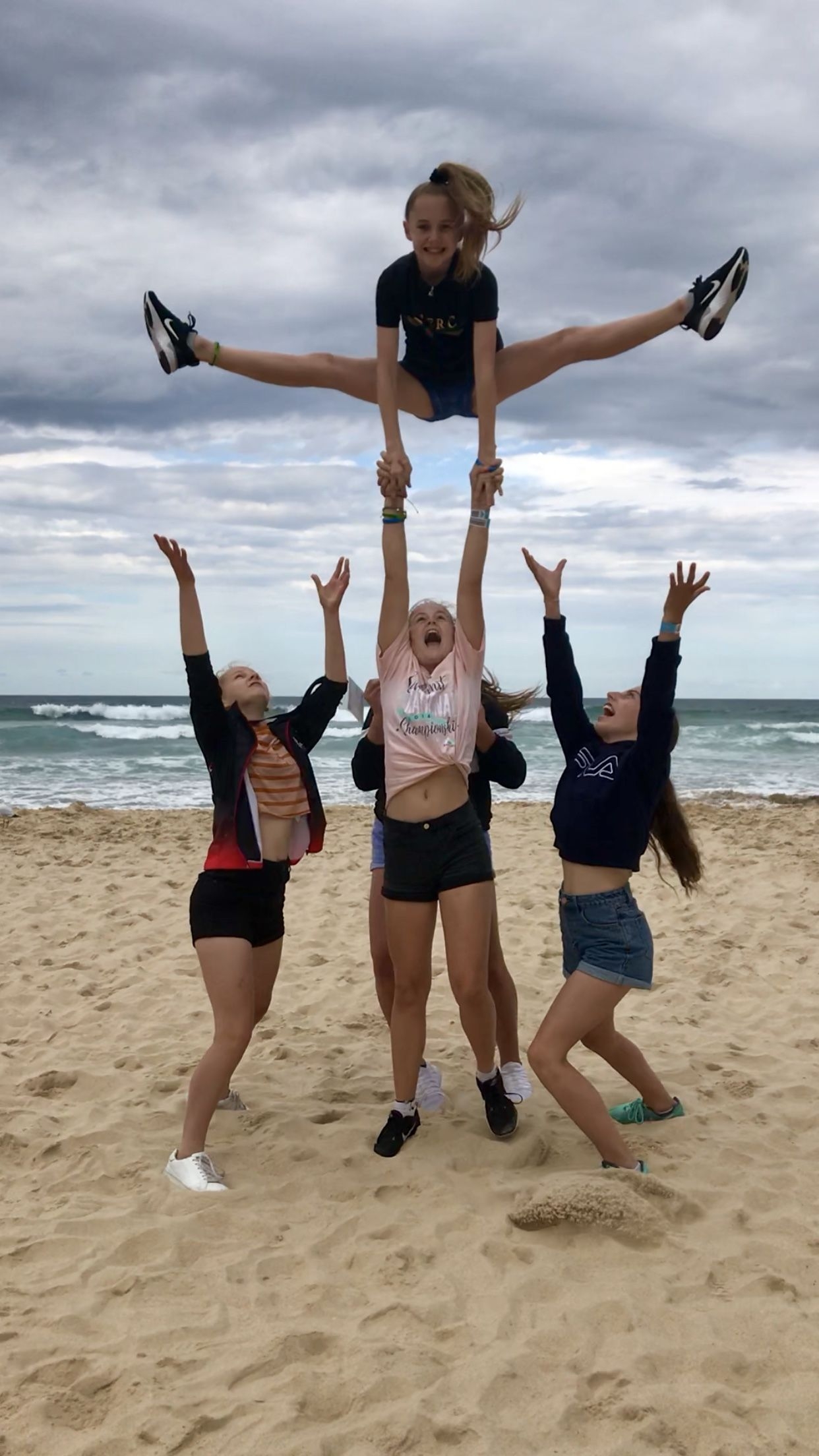 1250x2210 stunting on the beach. Cheer poses, Cheer picture, Cheer photography, Phone