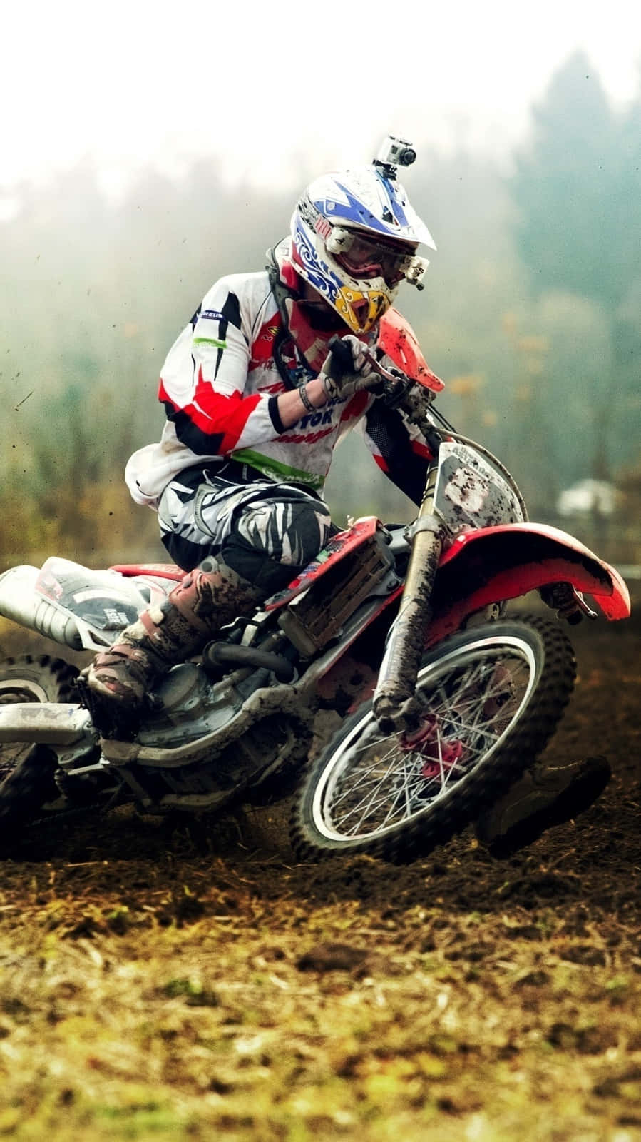 900x1600 Download Caption: Thrilling Ride Rider in Action Wallpaper, Phone