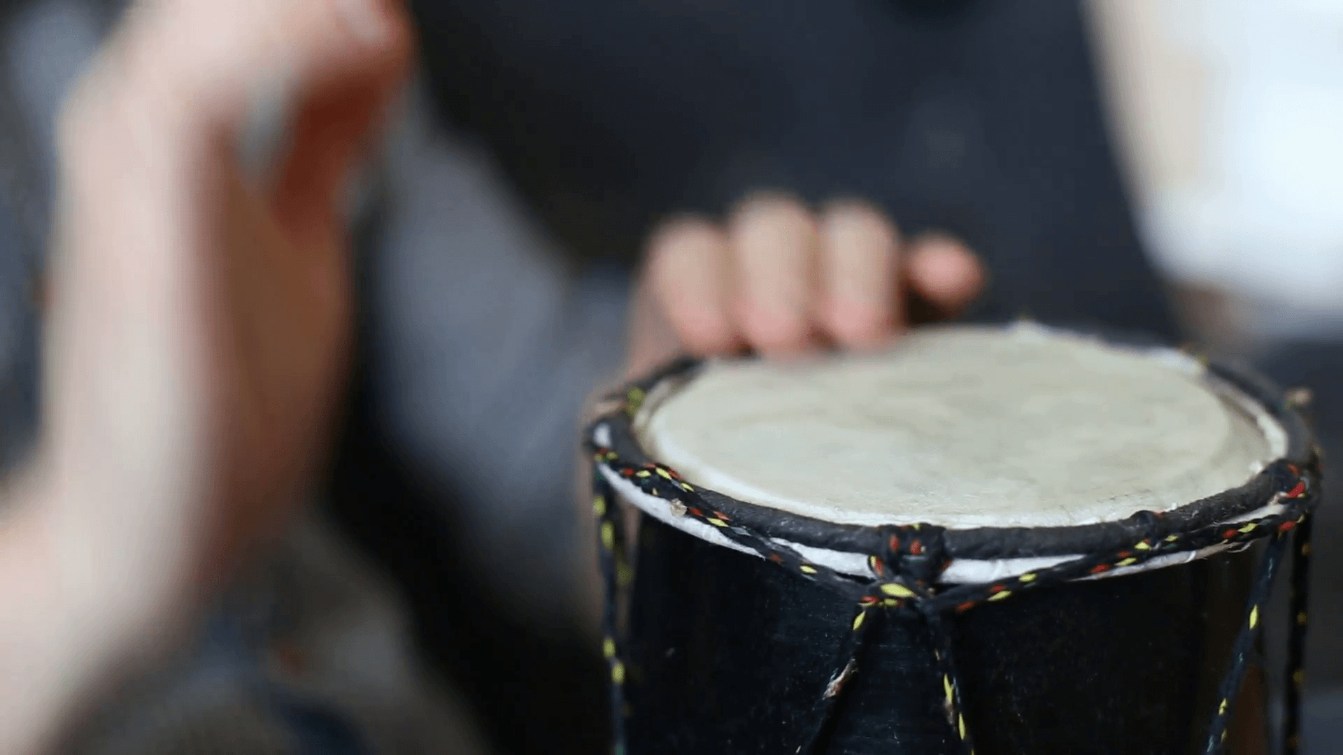 1920x1080 Playing Bongo drum close up HD stock footage. Hand tapping a Bongo, Desktop