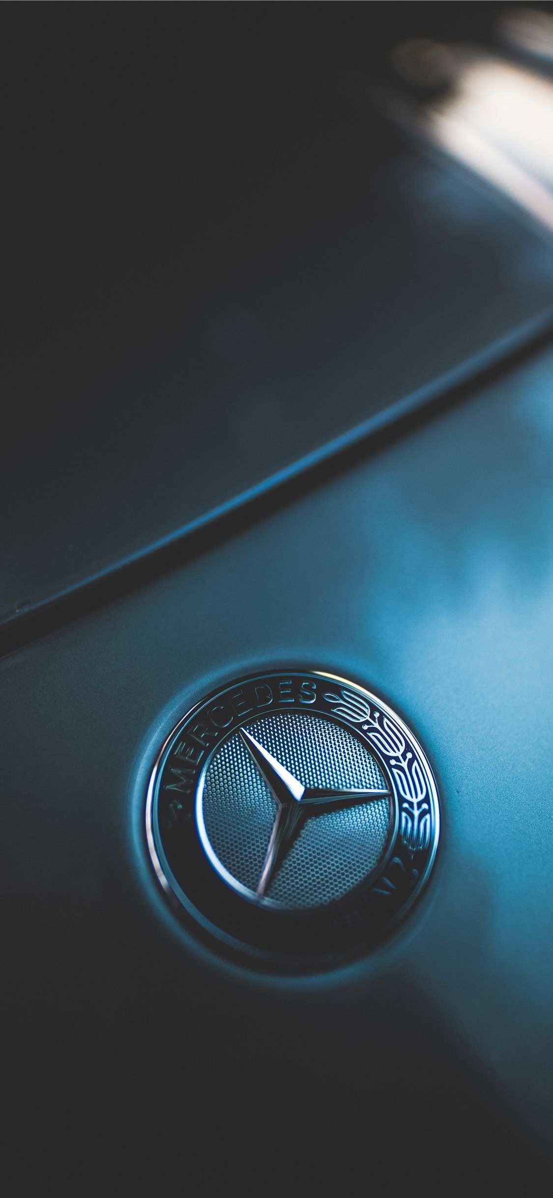 1130x2440 closeup photo of Mercedes Benz emblem iPhone X Wallpaper Free Download, Phone