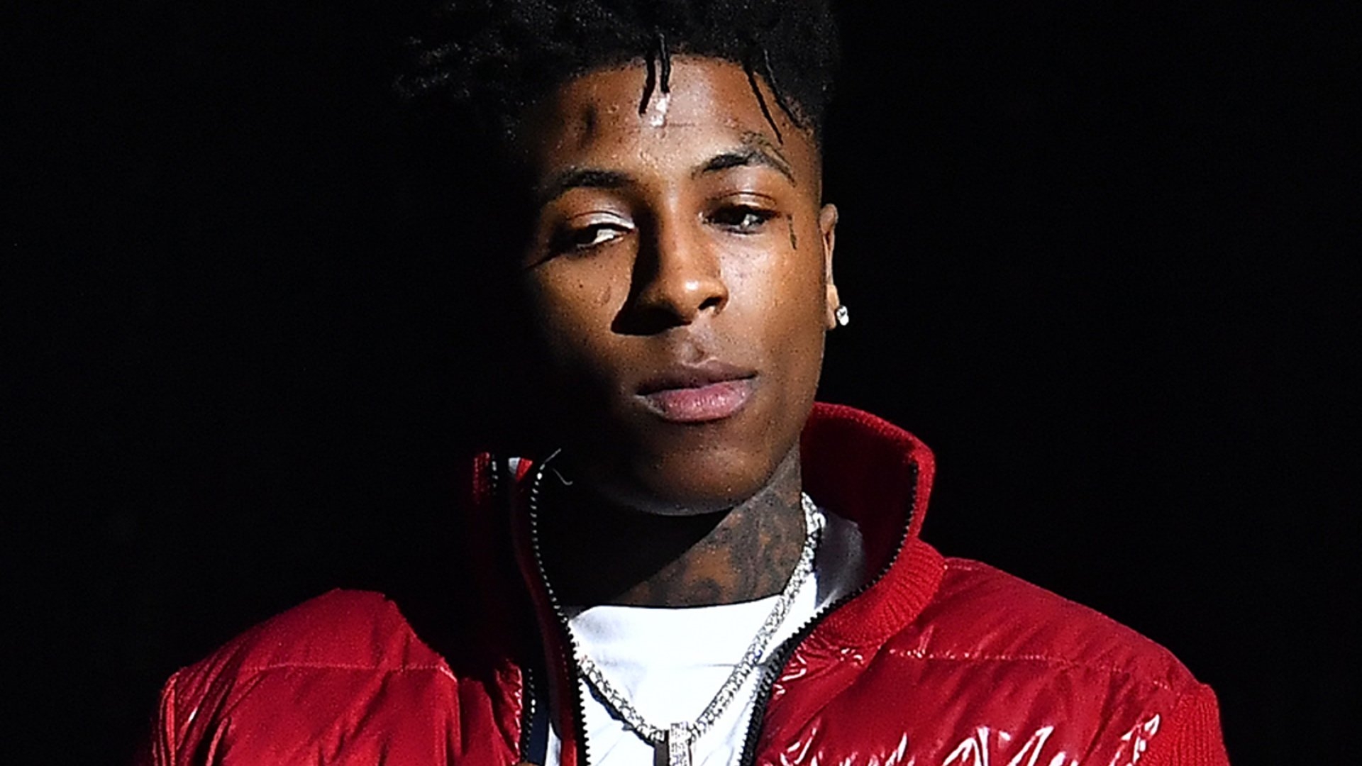 1920x1080 NBA Youngboy Is Wearing White T Shirt And Red Overcoat Standing In Black Background HD NBA Youngboy Wallpaper, Desktop