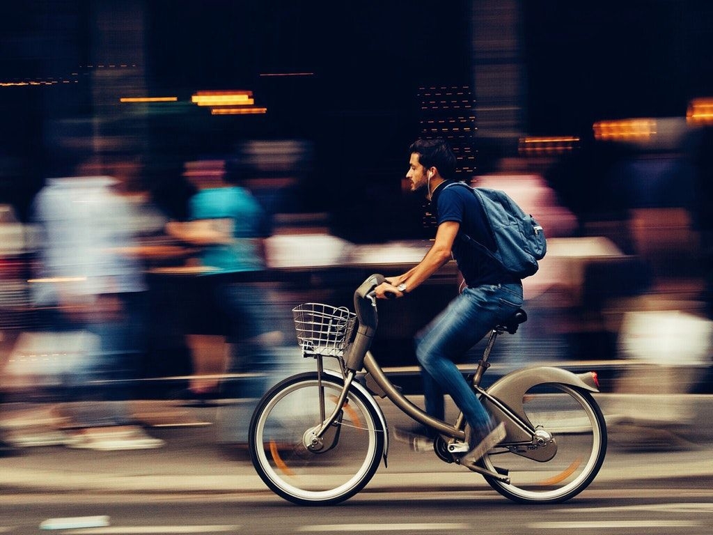 1030x770 Man Riding Bicycle on City Street HD Wallpaper, Desktop