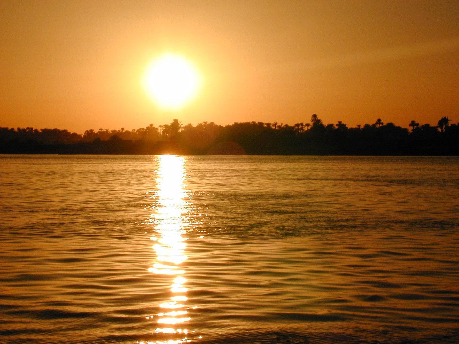 1600x1200 River's Edge: In this photo: Sun sets over the Nile River, which, Desktop