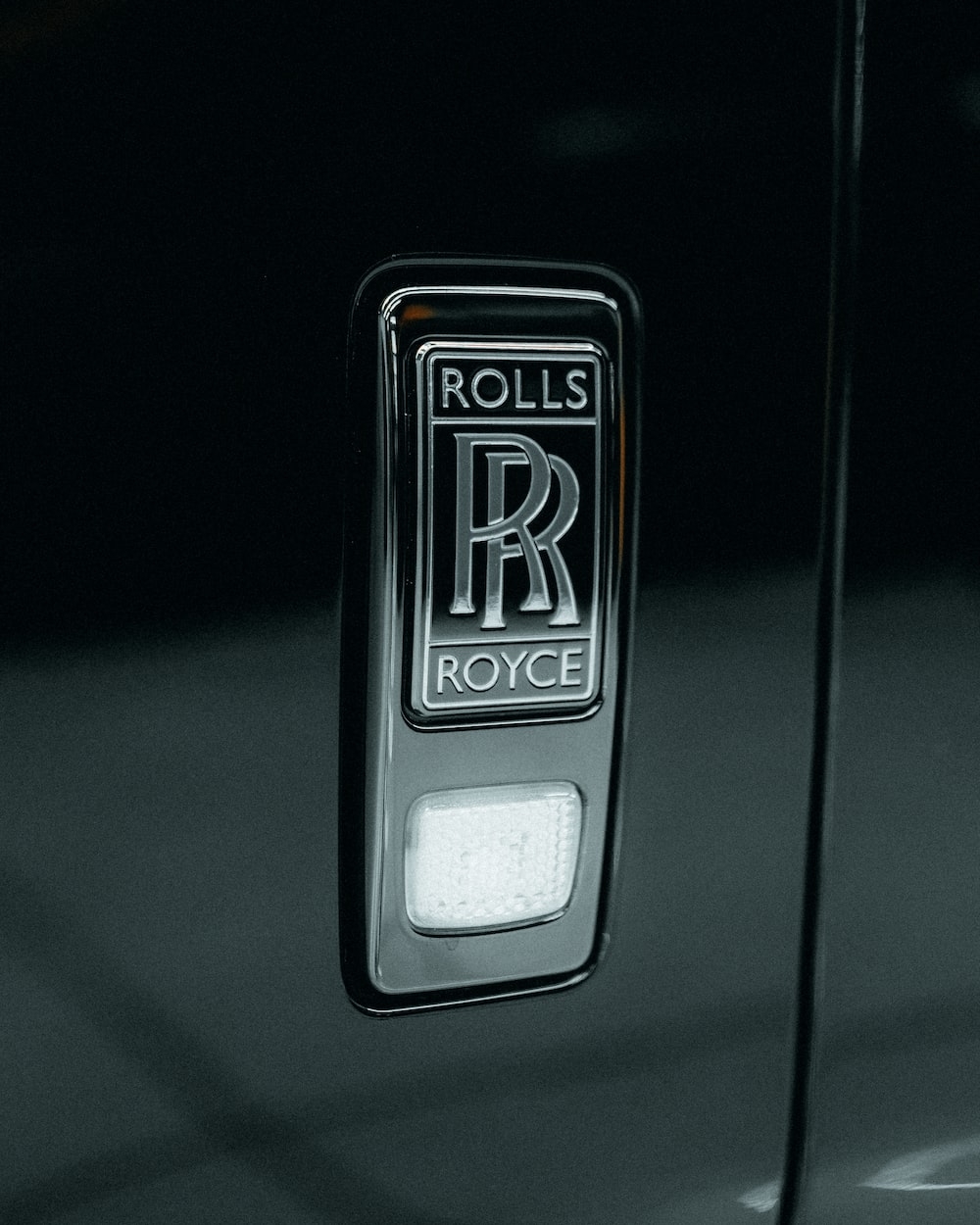 1000x1250 A rolls royce emblem on the door of a, Phone