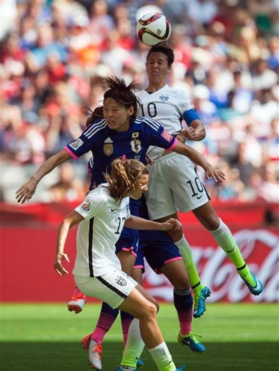 960x1280 United States' Carli Lloyd (10) outjumps Japan's Saki Kumagai to get, Phone