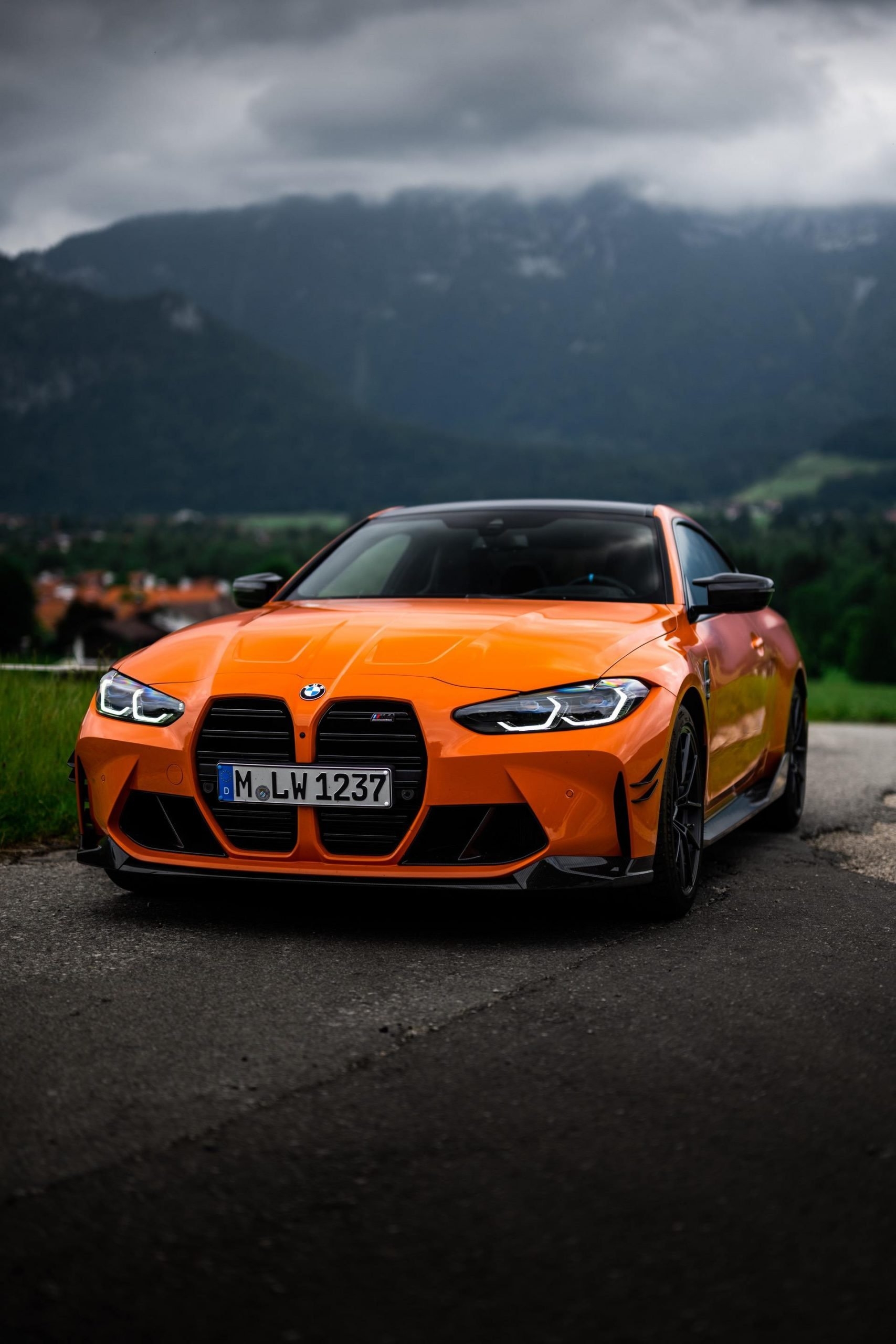 1710x2560 BMW M4 G82 in Fire Orange shows off its M Performance Parts and new exhaust, Phone