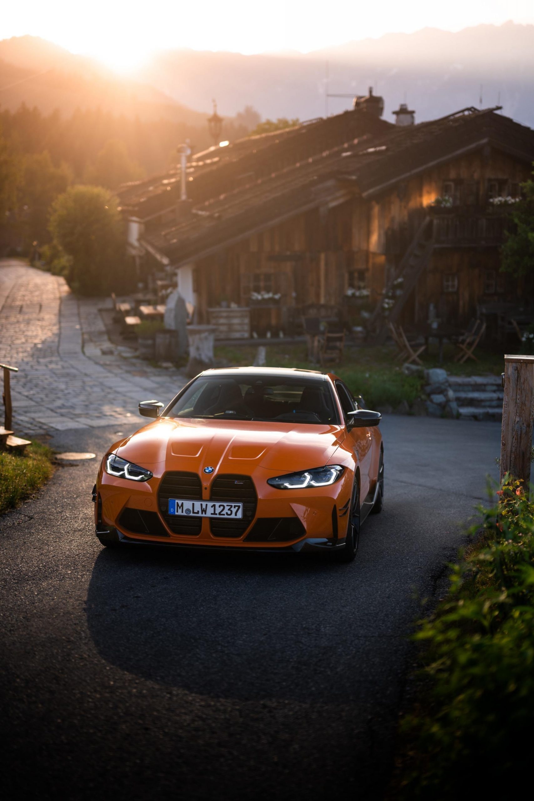 1710x2560 BMW M4 G82 in Fire Orange shows off its M Performance Parts and new exhaust, Phone