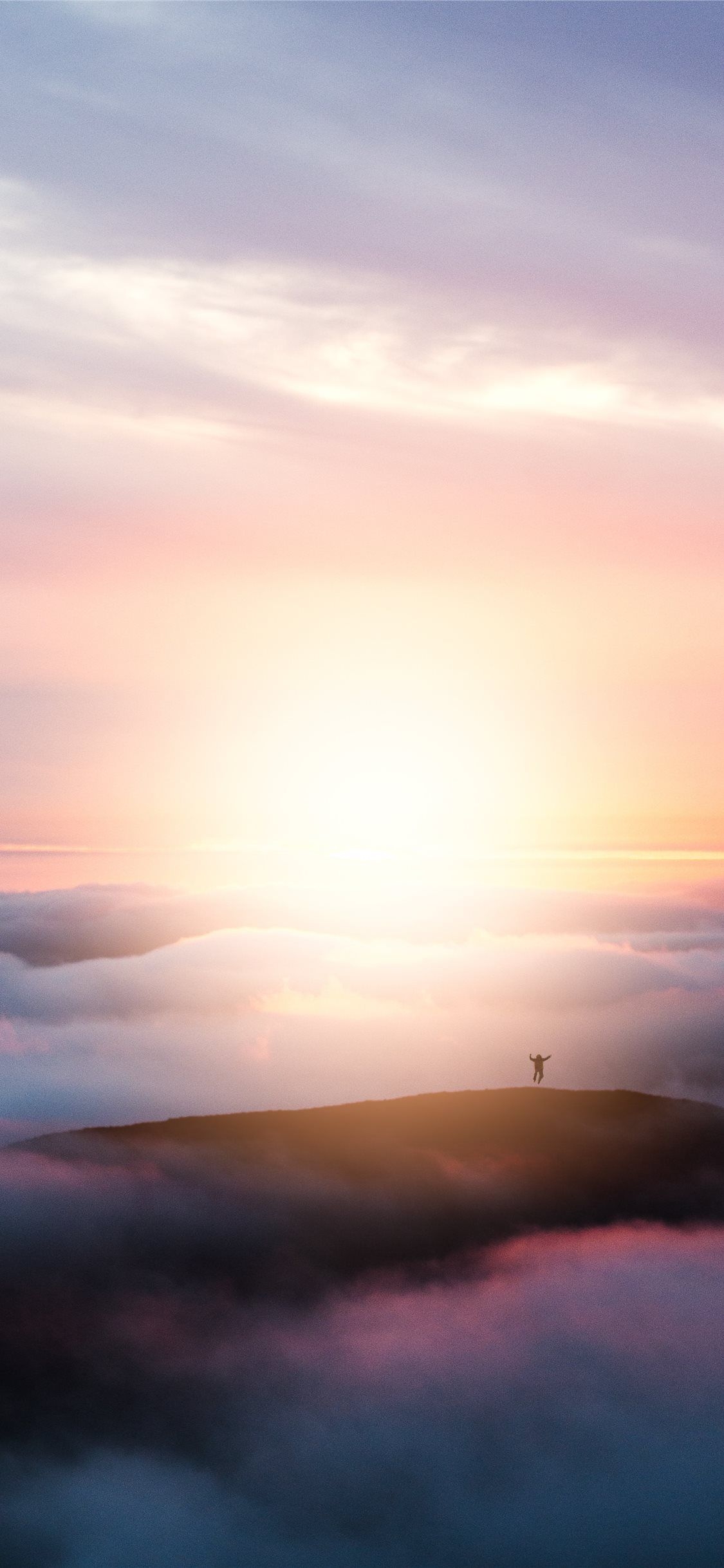 1130x2440 man jumping on hill during golden hour iPhone 11 Wallpaper Free, Phone