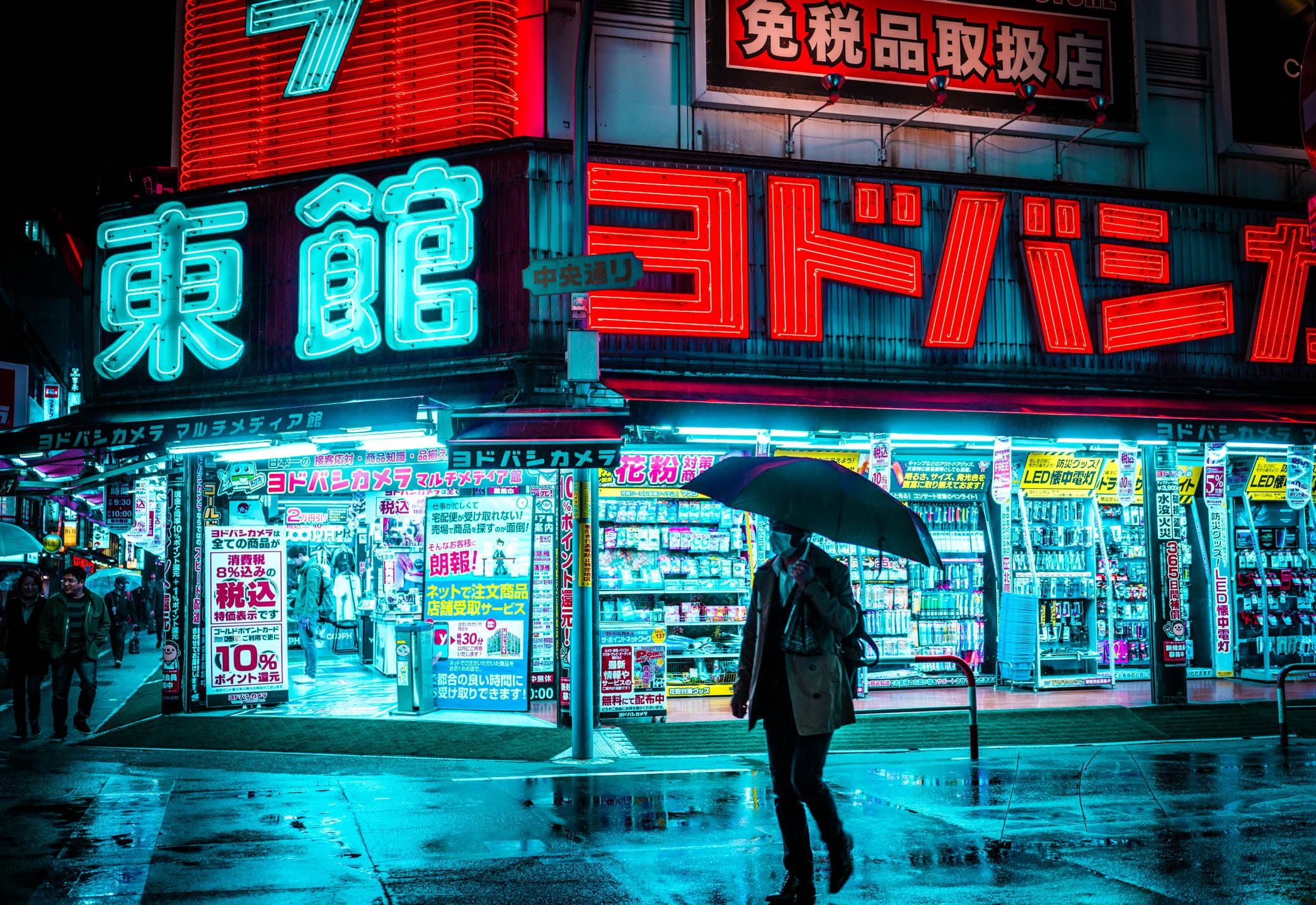 2090x1440 Man holding umbrella walking on the street near store during, Desktop