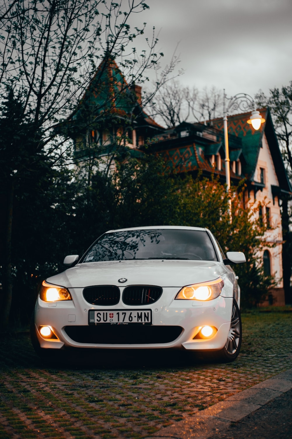 1000x1500 A white car parked in front of a house photo, Phone