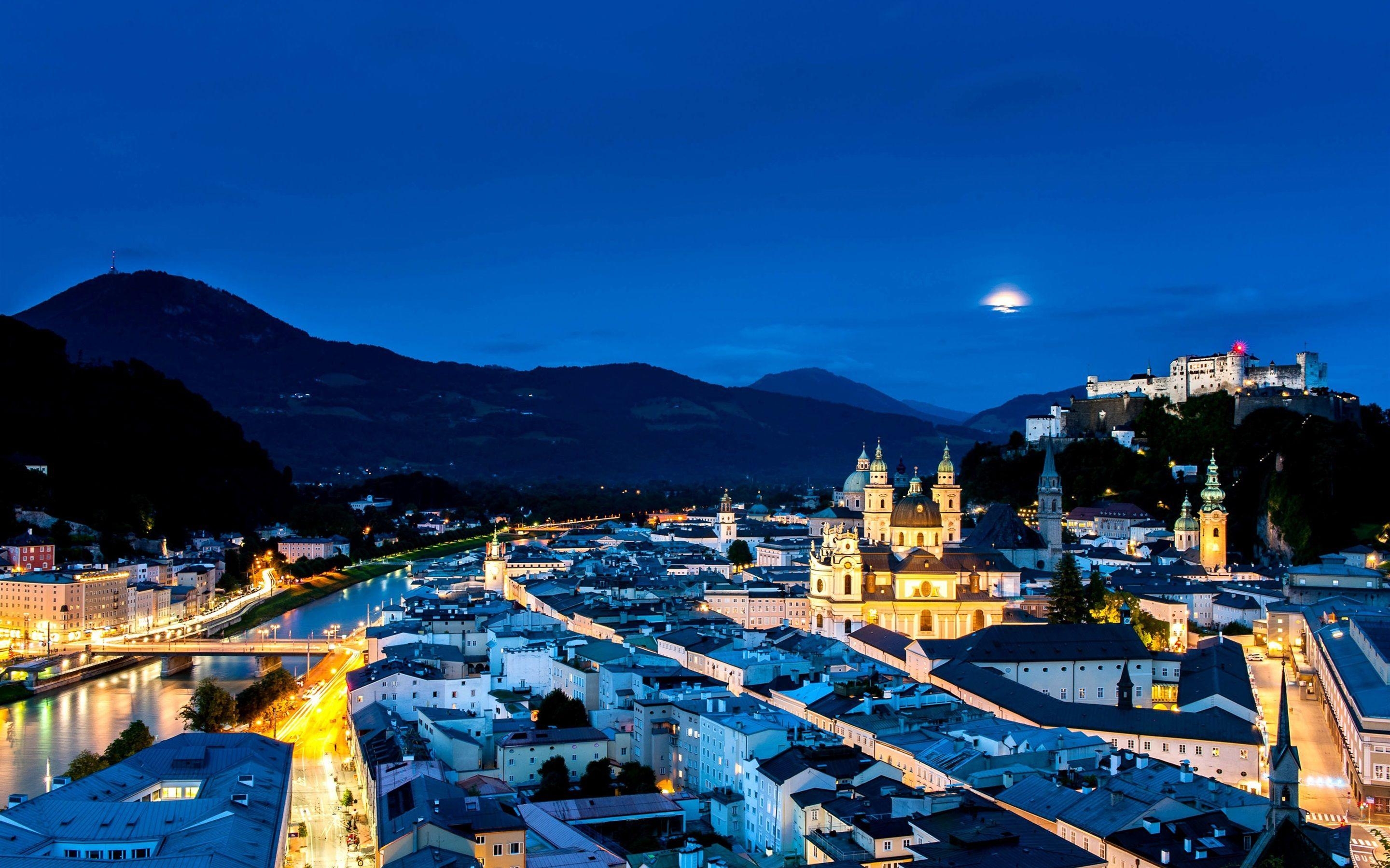 2880x1800 Austria, Salzburg, city night, street, houses, lights, mountains, Desktop