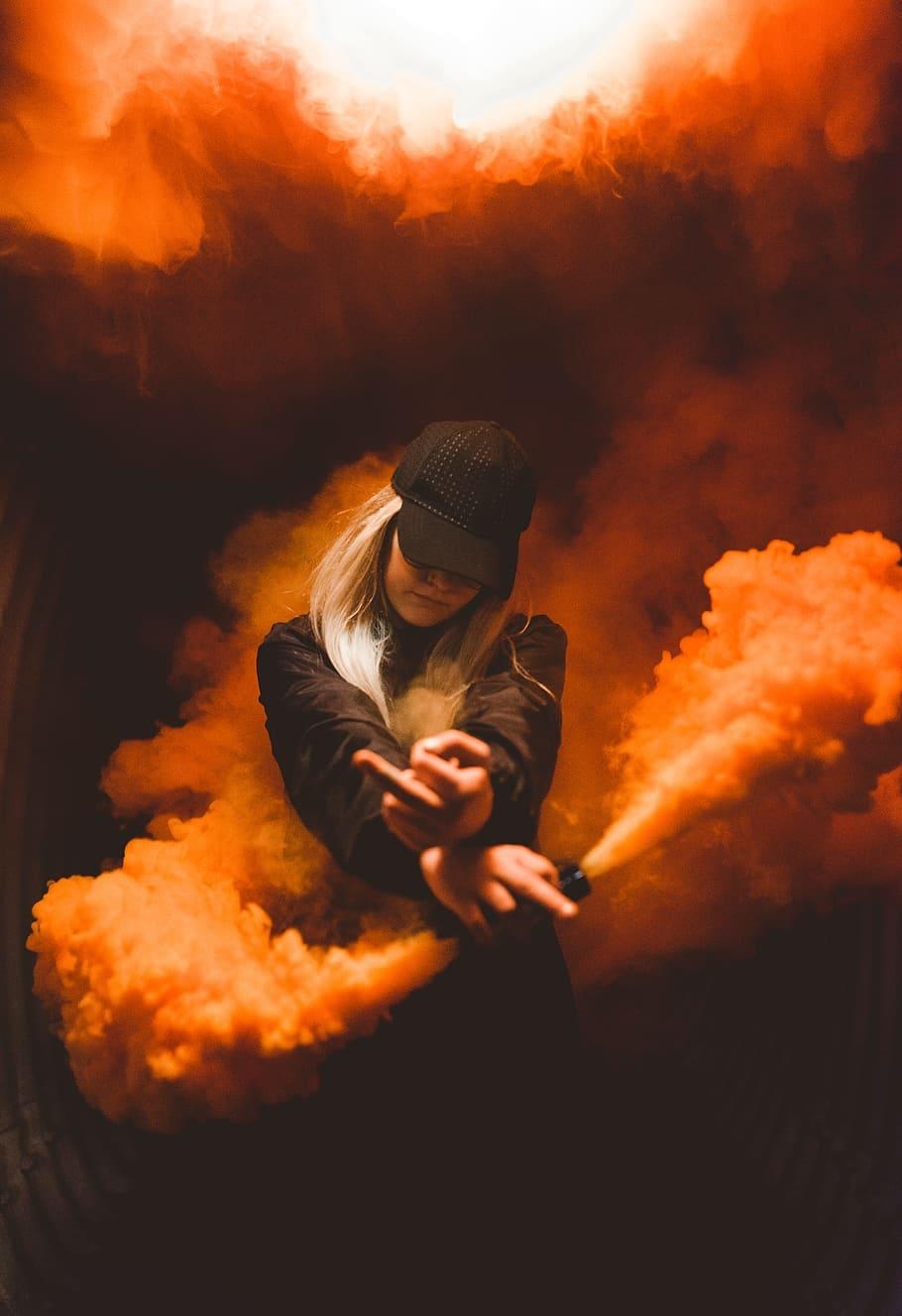 910x1330 HD wallpaper: smoke bomb, middle finger, person, hat, orange, Phone