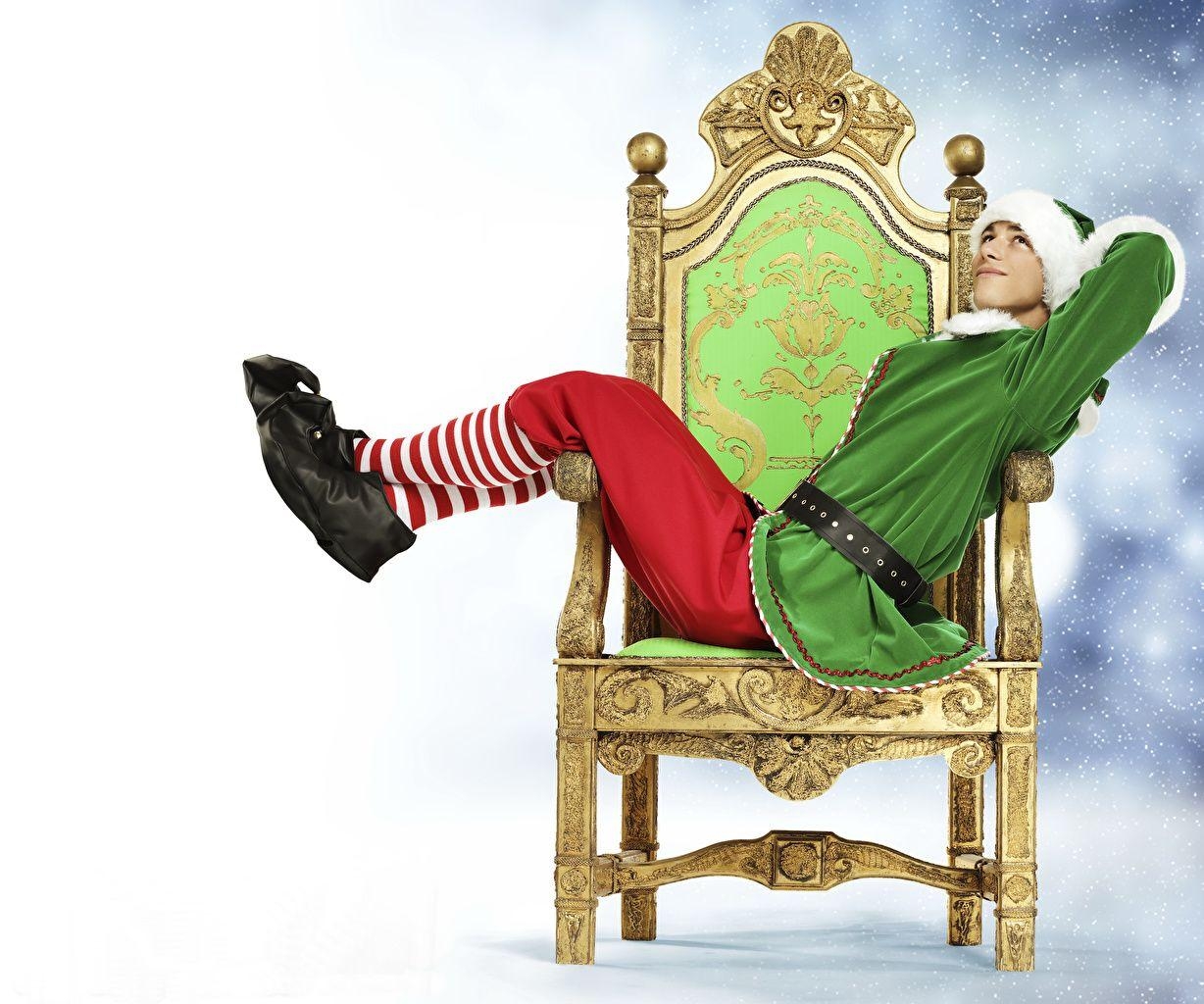 1230x1030 Wallpaper Elves New year Young man Legs Uniform Sitting Armchair, Desktop