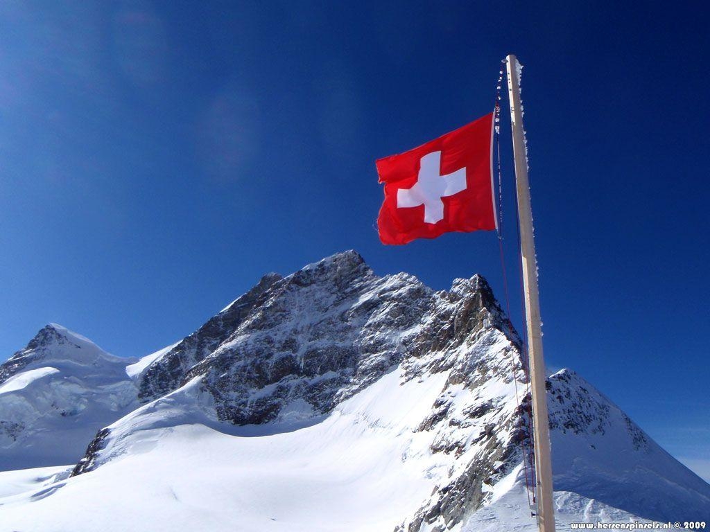 1030x770 Wallpaper: 'Jungfrau and flag' Swiss flag is flying proudly, Desktop