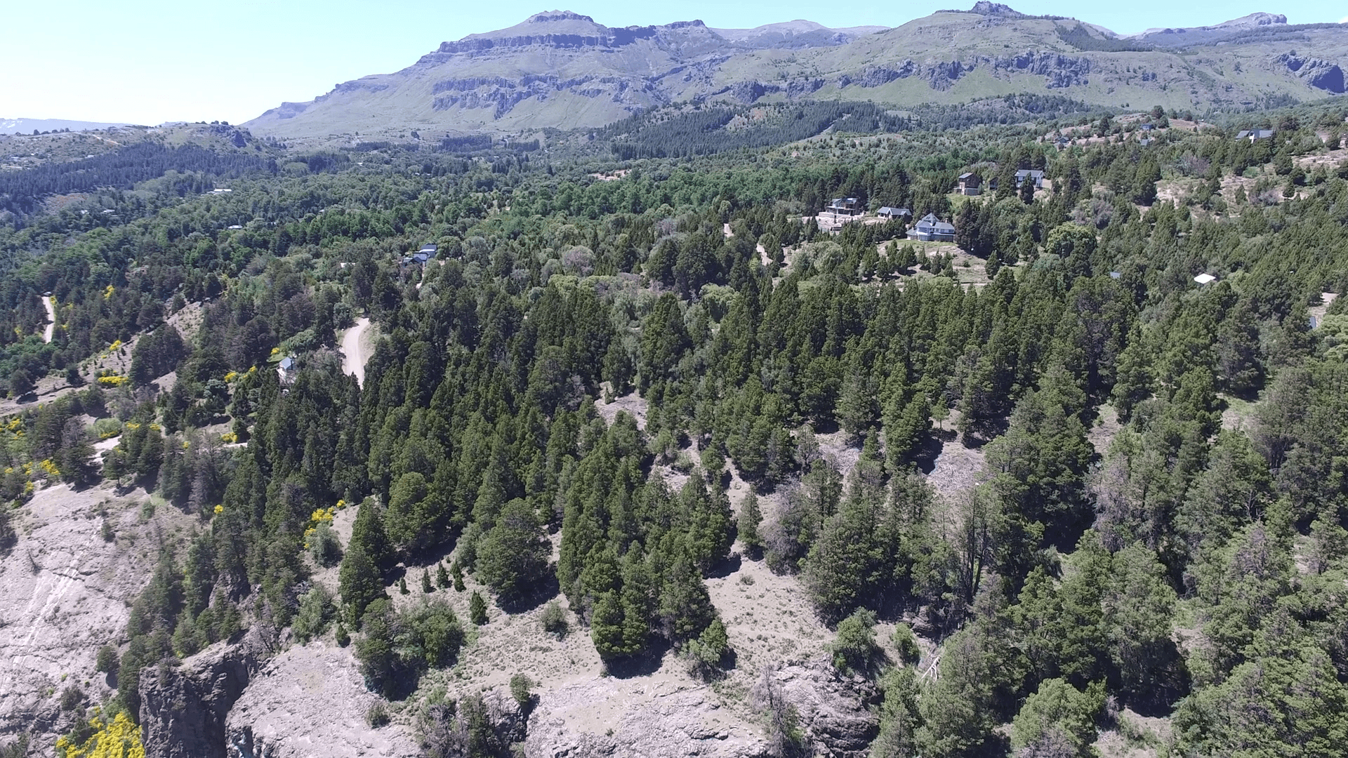 1920x1080 Aerial drone scene of houses in the woods in mountain in south, Desktop