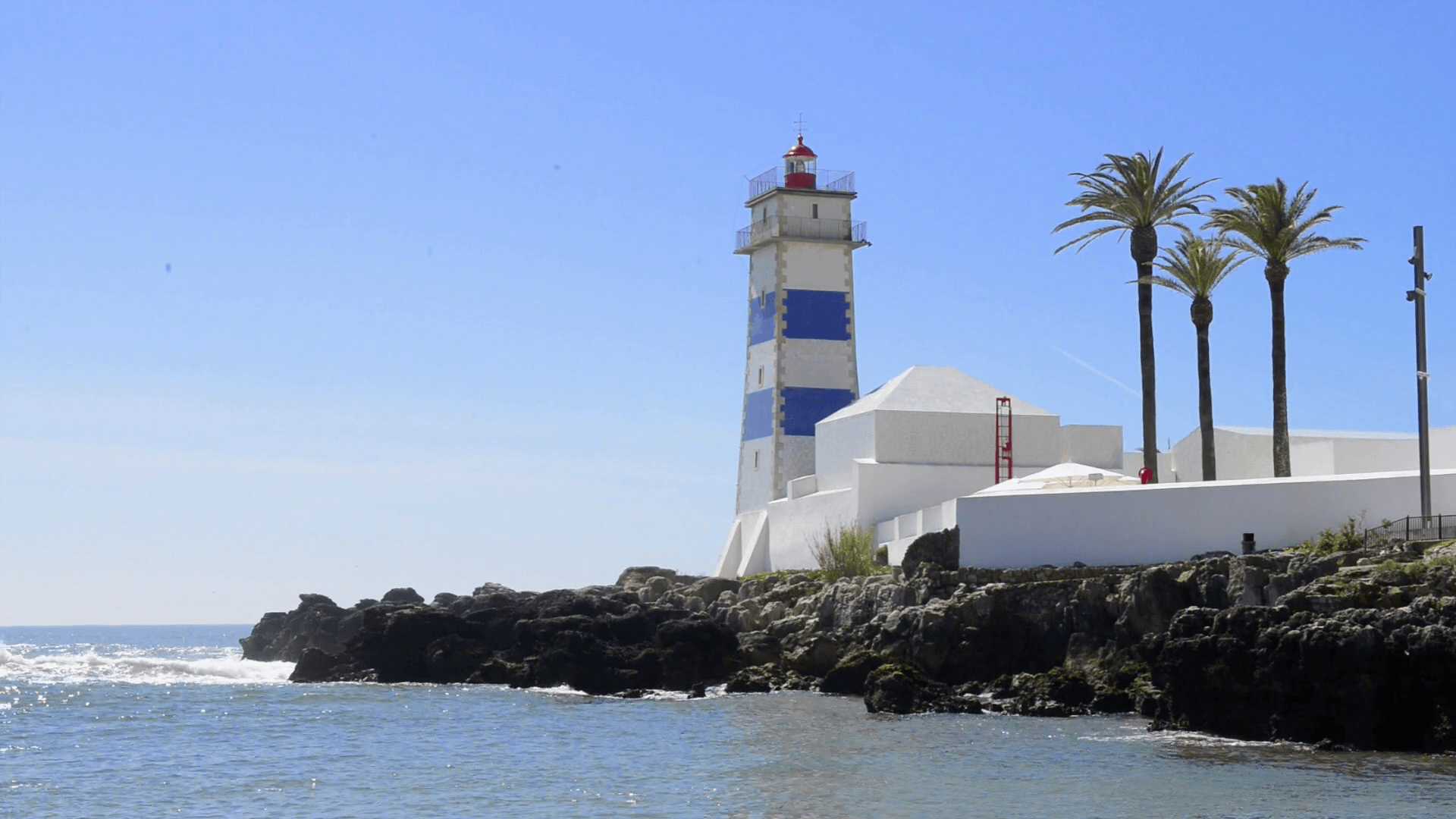 1920x1080 Santa Marta lighthouse in Cascais, Portugal. Stock Video Footage, Desktop