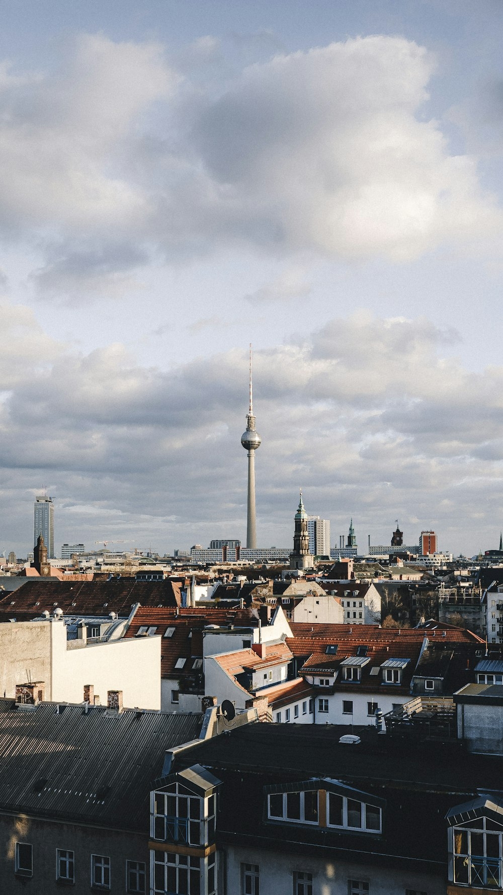 1000x1780 A view of a city skyline with a tower in the background photo, Phone