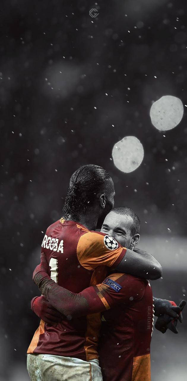 630x1280 Galatasaray Players Hugging Wallpaper, Phone