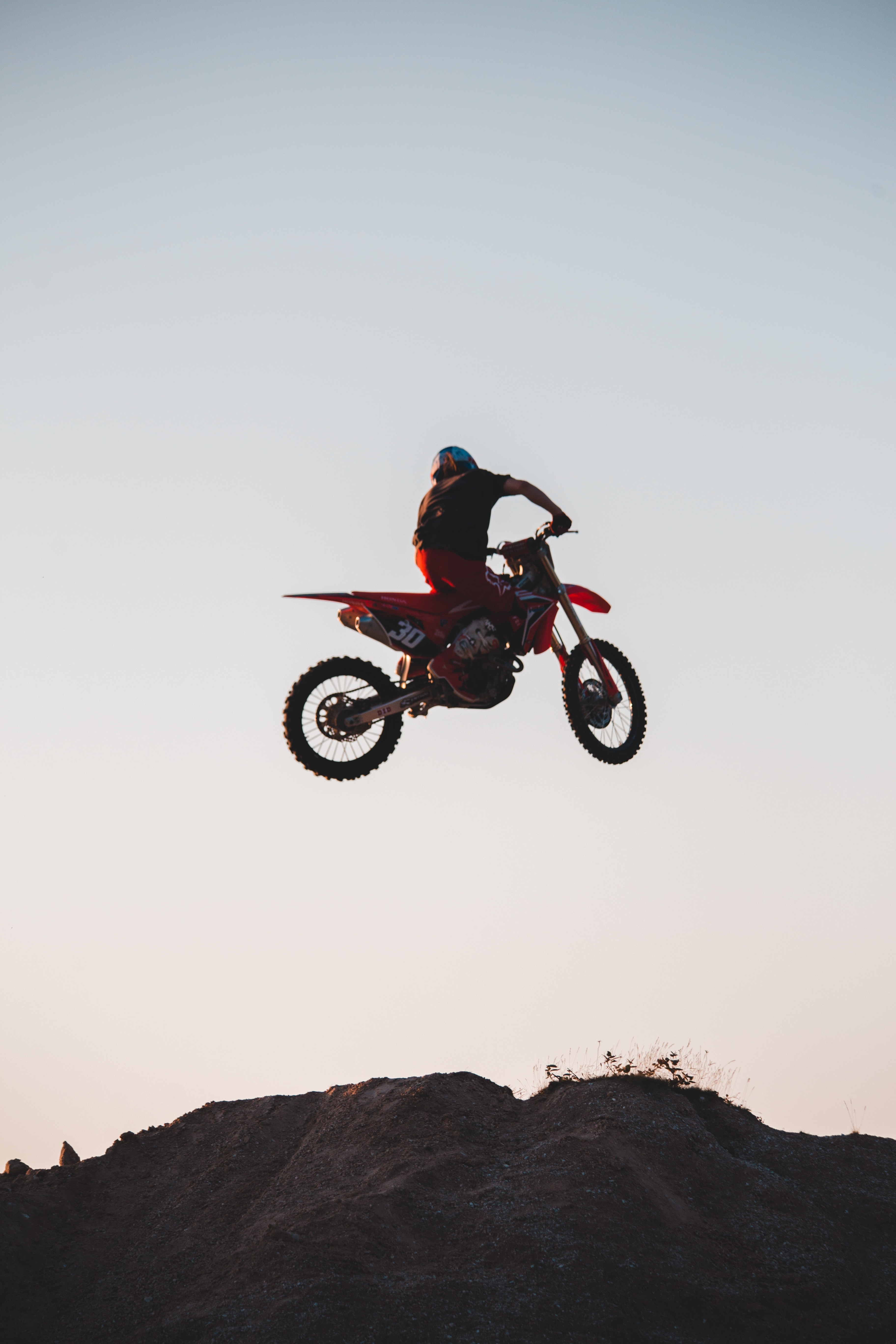 3650x5480 Man Riding a Dirt Bike Jumping on ta Ramp · Free, Phone