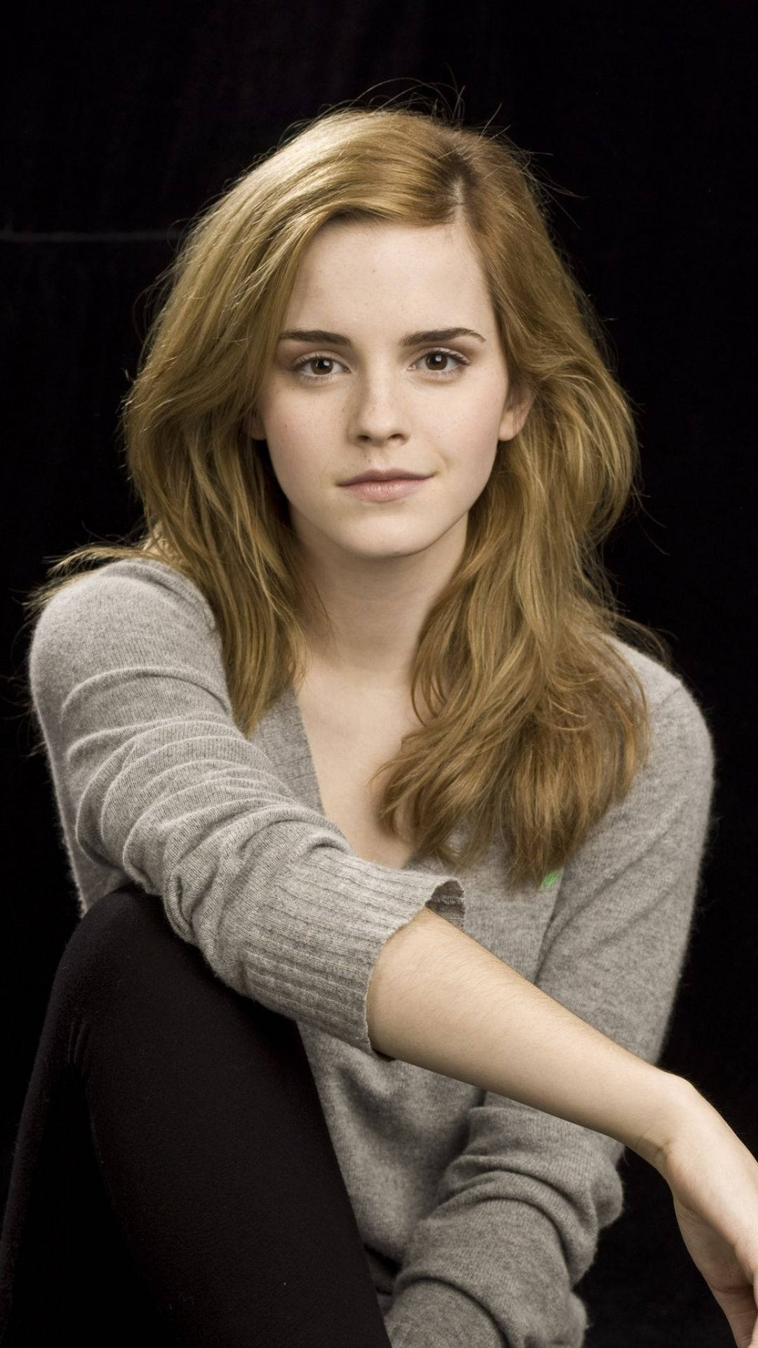 1080x1920 Download Emma Watson looking stylish in a casual setting Wallpaper, Phone