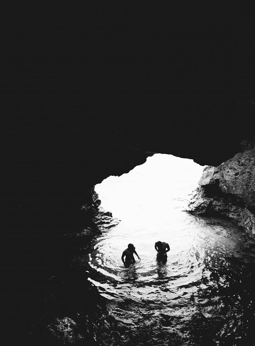 890x1200 ✅ iPhone Wallpaper Grayscale Photo Of Two Men In Cave With Body Of Water iPhone Background Image, Phone