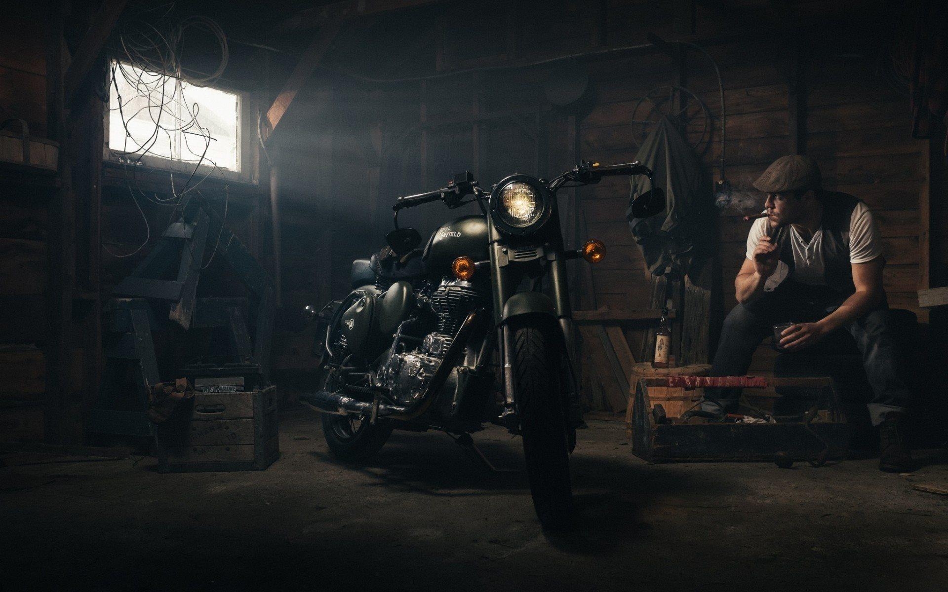 1920x1200 Download wallpaper royal enfield, garage, motorcycle, smoking man, Desktop