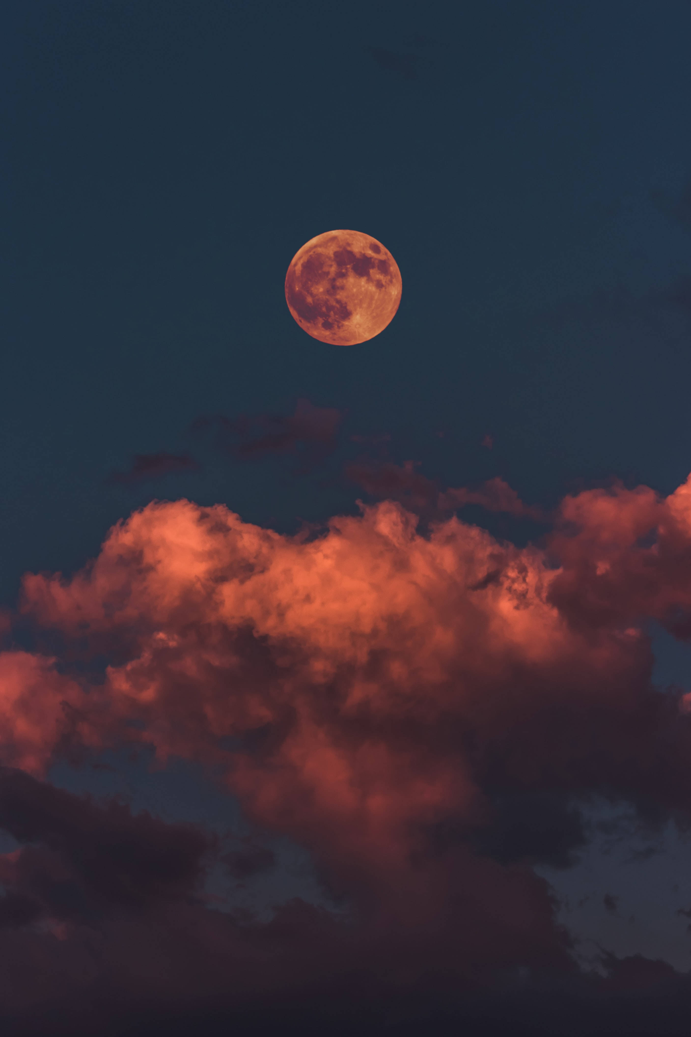 2820x4230 Download Spectacular Red Moon Glow On A Cloud Strewn Night Sky Ultra HD Wallpaper, Phone