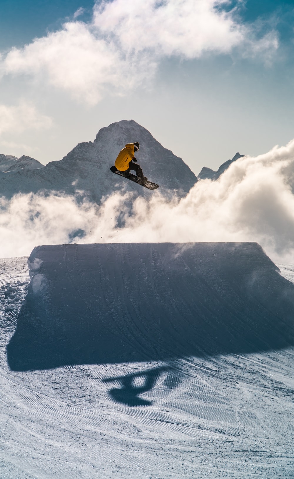 1000x1630 Man in orange jacket and black pants riding on snowboard on snow covered mountain during daytime photo, Phone