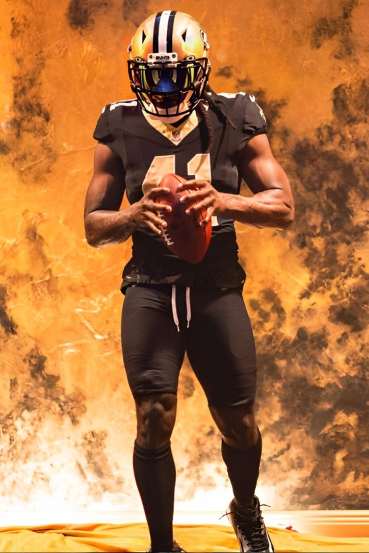 740x1110 Dynamic Alvin Kamara Wallpaper for NFL Fans, Phone