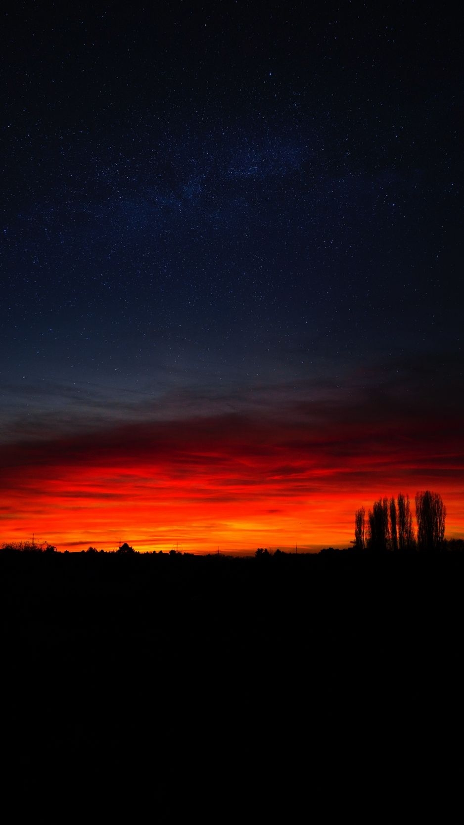 940x1670 Download wallpaper  sunset, horizon, night, starry sky, Phone